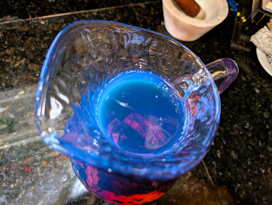 Cold-steeped palo azul (kidney wood) tea showing its gorgeous blue color.