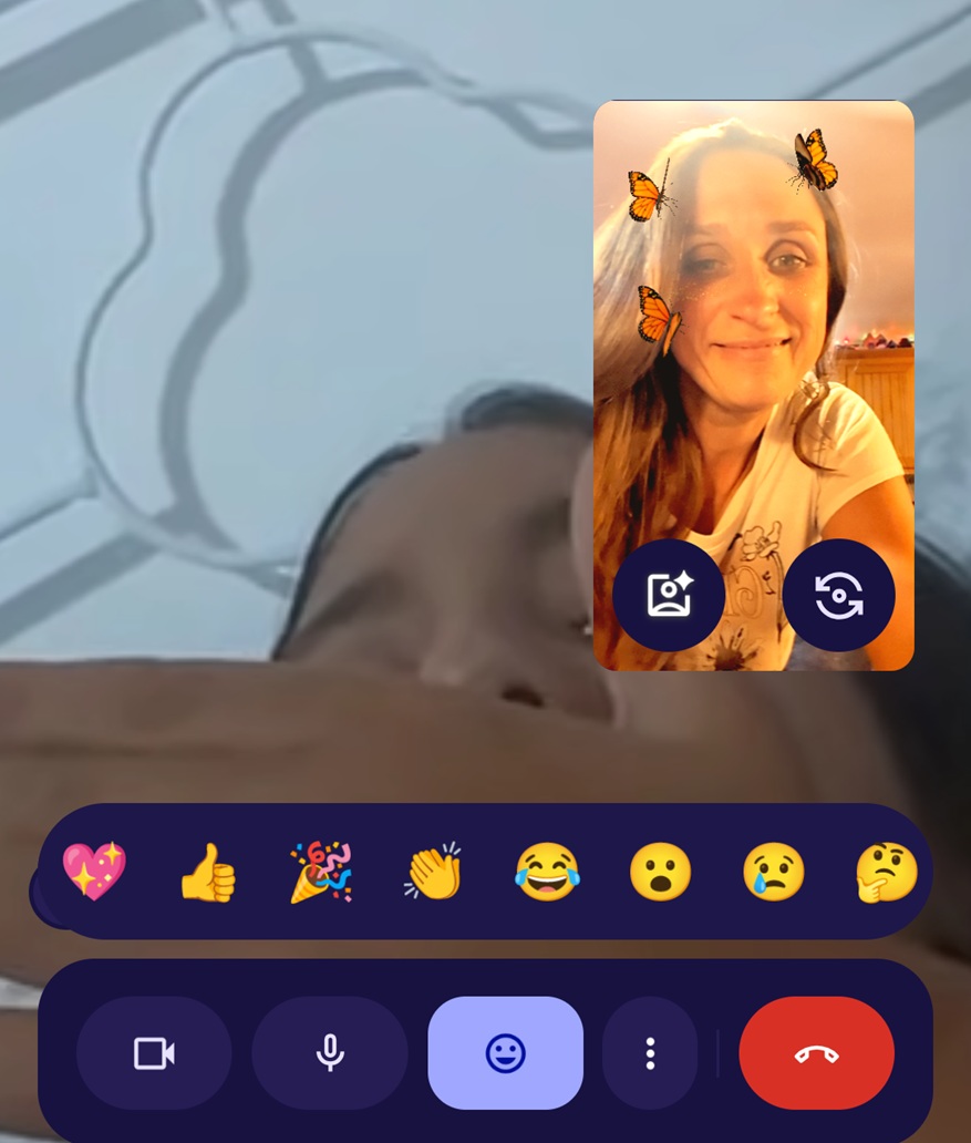 Goofing off on the phone with my girl, with butterflies in my hair.
