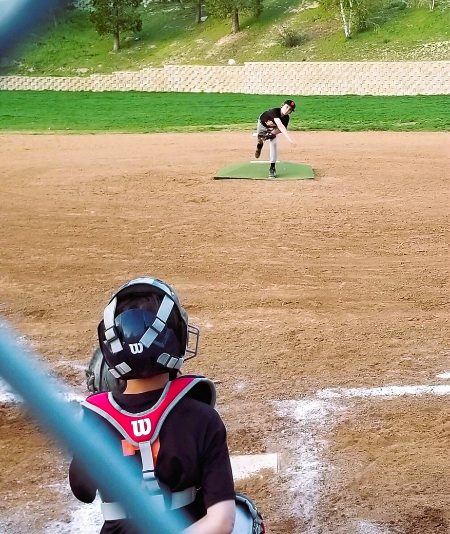 Baseball pitch head on.