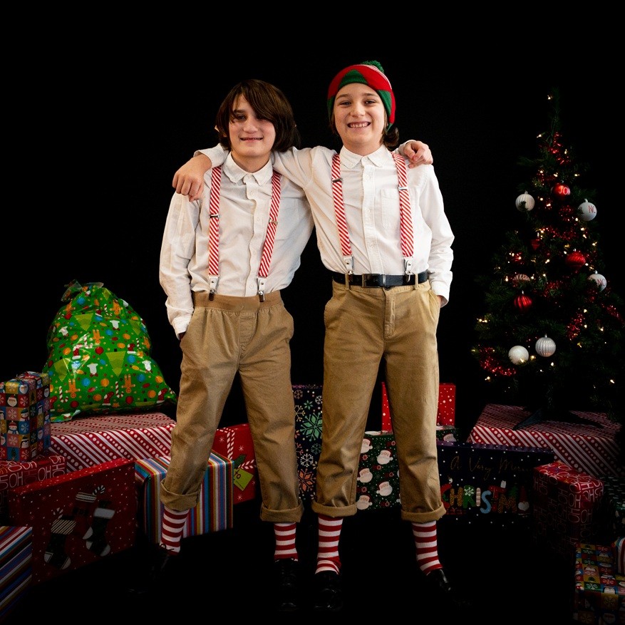 Boys dressed as elves the night before Christmas.