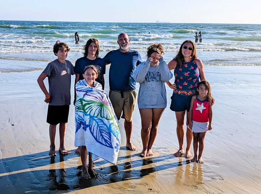 Family on the beach homeschool adventure.