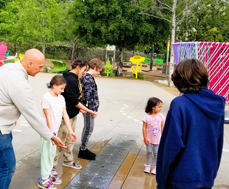 Family at water spouts.